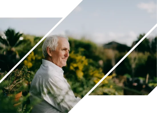 An elderly man enjoying his retirement in a lush landscape.