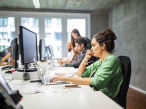 Business Woman Working at Laptop