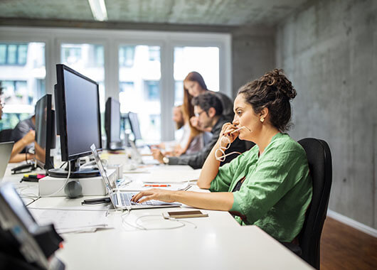 Business Woman Working at Laptop