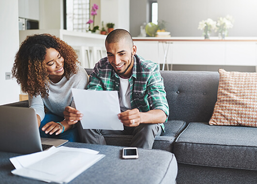 Couple at computer doing taxes