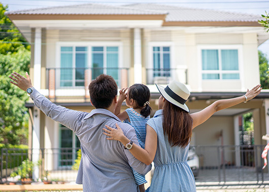 Family in front of new home