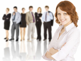 Young business team with business woman in front.