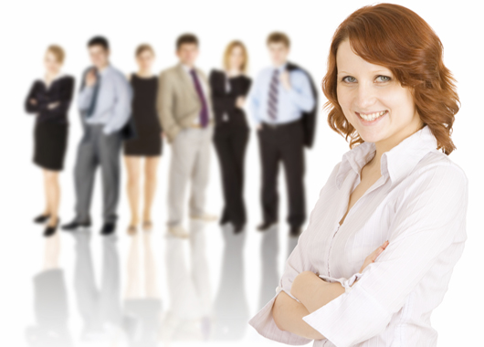 Young business team with business woman in front.