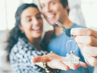 Couple holding a house key