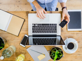 Woman at laptop with credit card