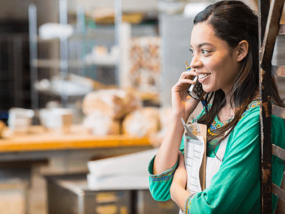 Woman talking on the phone in green shirt