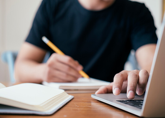 Student studying at laptop