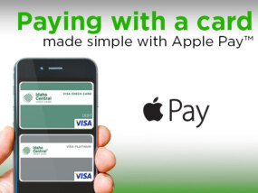 Phone with ICCU debit and credit cards on screen. Promoting Apple pay features.