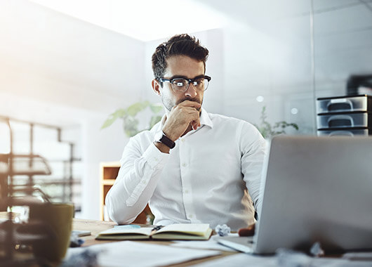 Businessman working on a laptop.