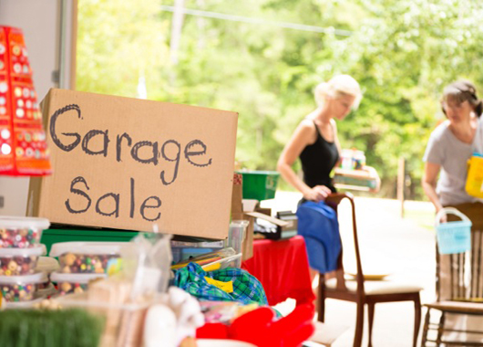 Garage full of items ready to be sold at garage sale.