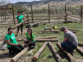 ICCU Team Members Volunteering Making Fences at the Zoo|Idaho Central team members presenting a check to the Hispanic Chamber of Commerce.