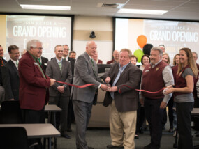 ICCU CEO Kent Orem cuts grand opening ribbon for the new ISU Learning Center