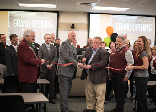 ICCU CEO Kent Orem cuts grand opening ribbon for the new ISU Learning Center