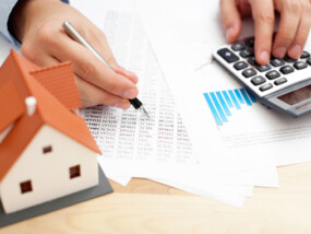 Closeup of man counting payments for home