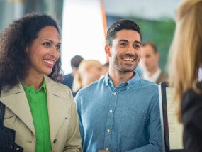 Couple talking to credit union teller