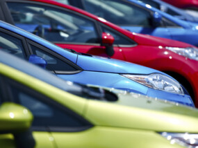 Close up shot of multiple cars on a car lot.