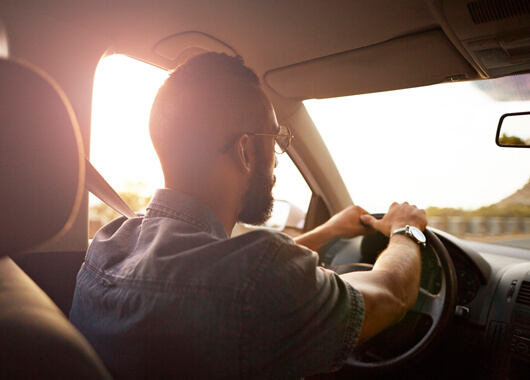 man driving vehicle