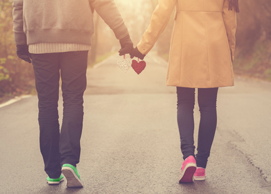 couple in love holding hearts