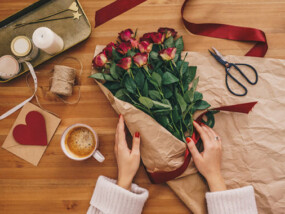 Women arranging red roses