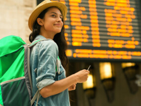 Woman traveling at train station.