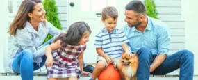 Family sitting on their front porch