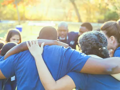 Group of people huddled