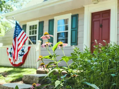 House with an American Flag hanging outside