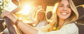 Mom and daughter driving