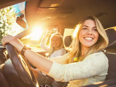 Mom and daughter driving