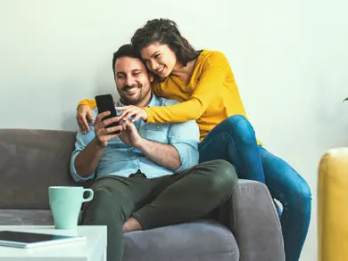 Couple looking at a phone together
