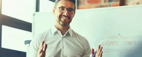 Man discussing information on a whiteboard