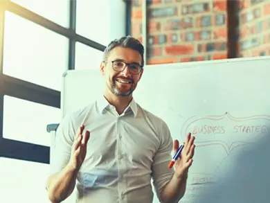 Man discussing information on a whiteboard