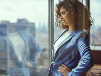 Business women staring out a window