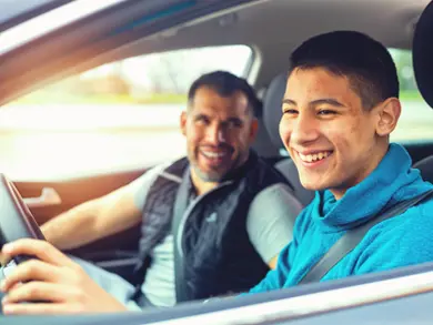 Dad and son driving