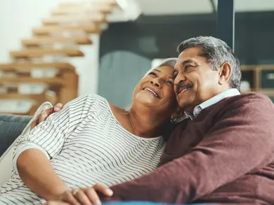 Elderly couple hugging