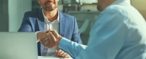 Business partners shaking hands