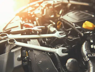 Tools on top of a car engine