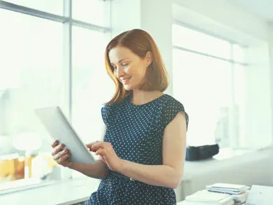 women browsing her tablet