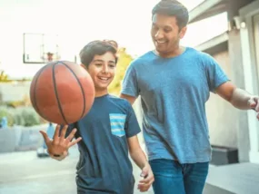 Father and Son walking with a basketball