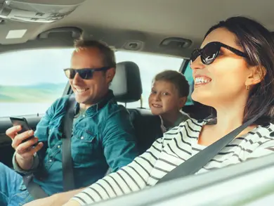 a family driving in their car