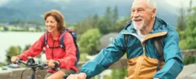 Elderly couple riding their bikes