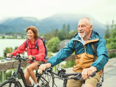 Elderly couple riding their bikes