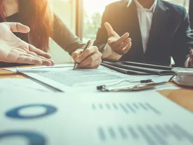 Business people talking around a table