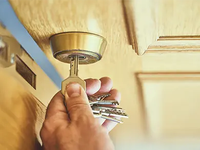 someone unlocking a door with keys