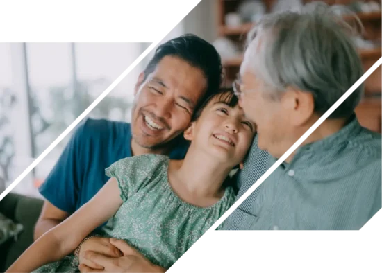 A man and girl laugh with an elderly man.